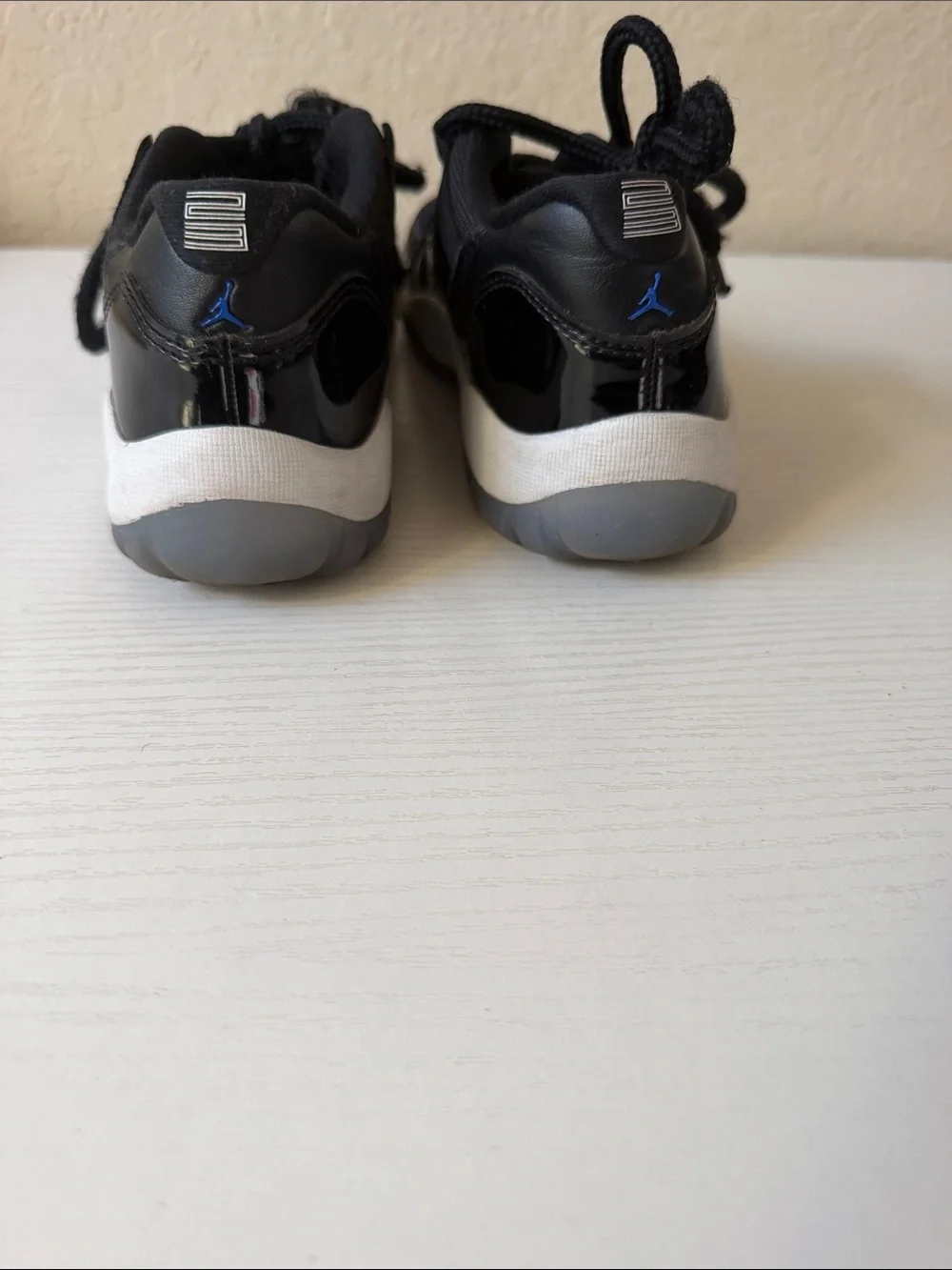 Jordan low 11’s Kids Black Basketball Sneakers with Blue Logo